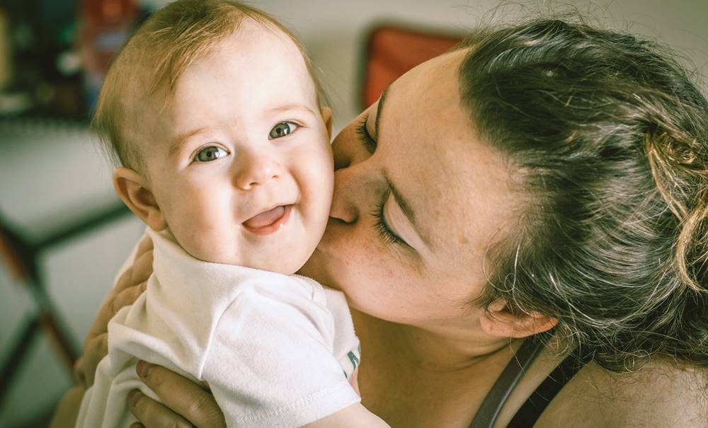parenting mom loving kid laughing happy